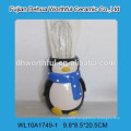 Creative ceramic utensil holder with penguin design